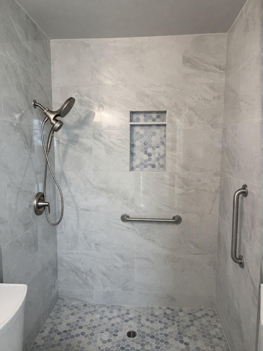 Finished shower before the glass went in: ceramic tile, niche and two grab bars