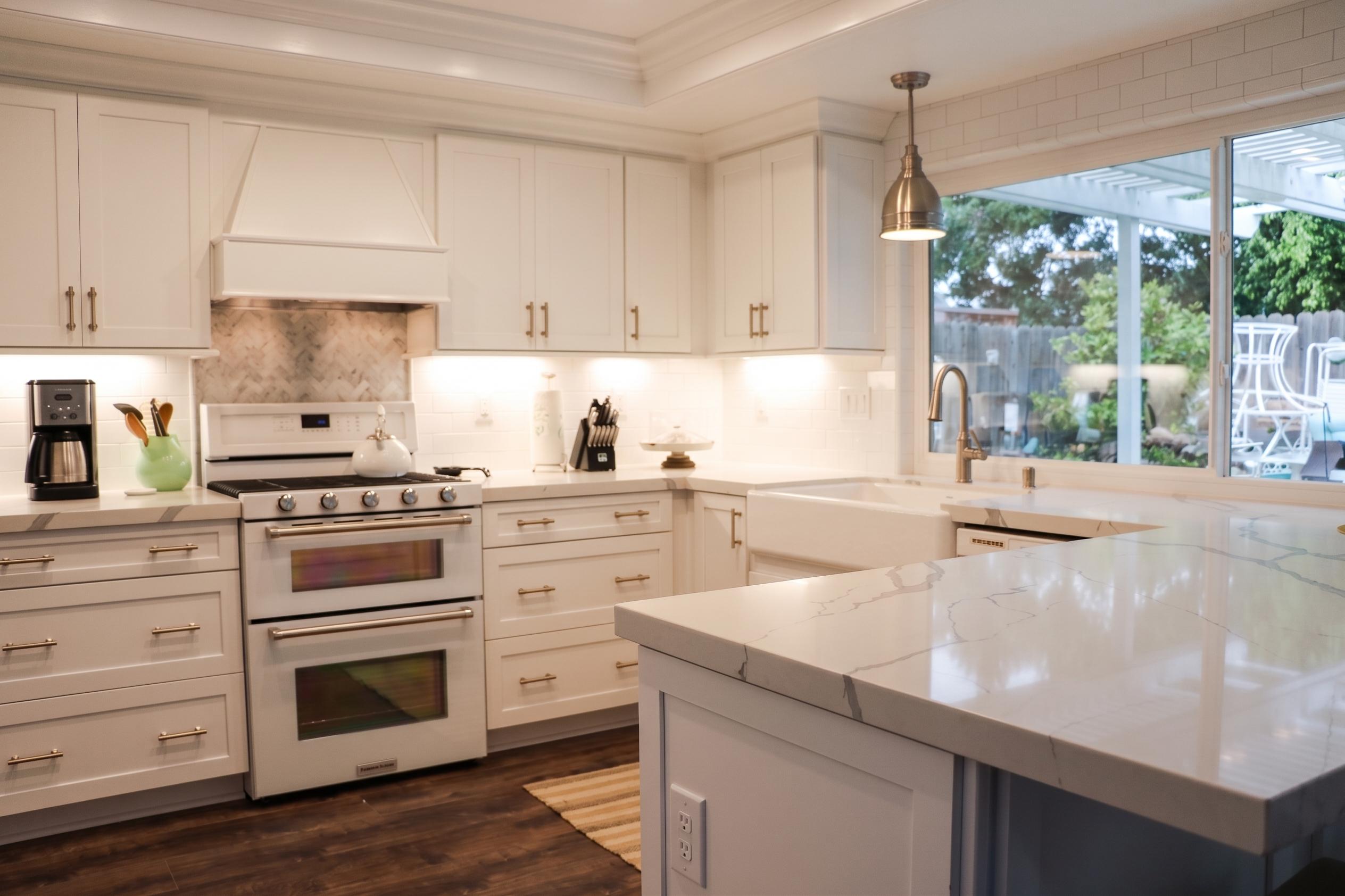 Kitchen remodel: white shaker cabinets and quartz island
